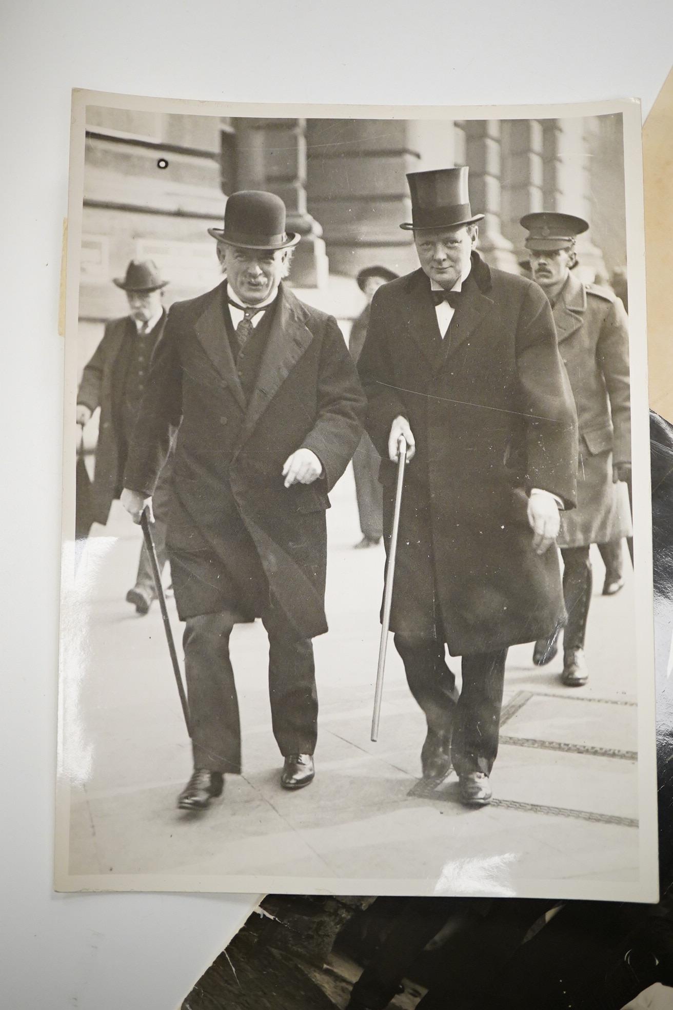 Four 20th century black and white agency photographs of Winston Churchill, together with a watercolour of Vera C.Clark by Vivian Entwistle